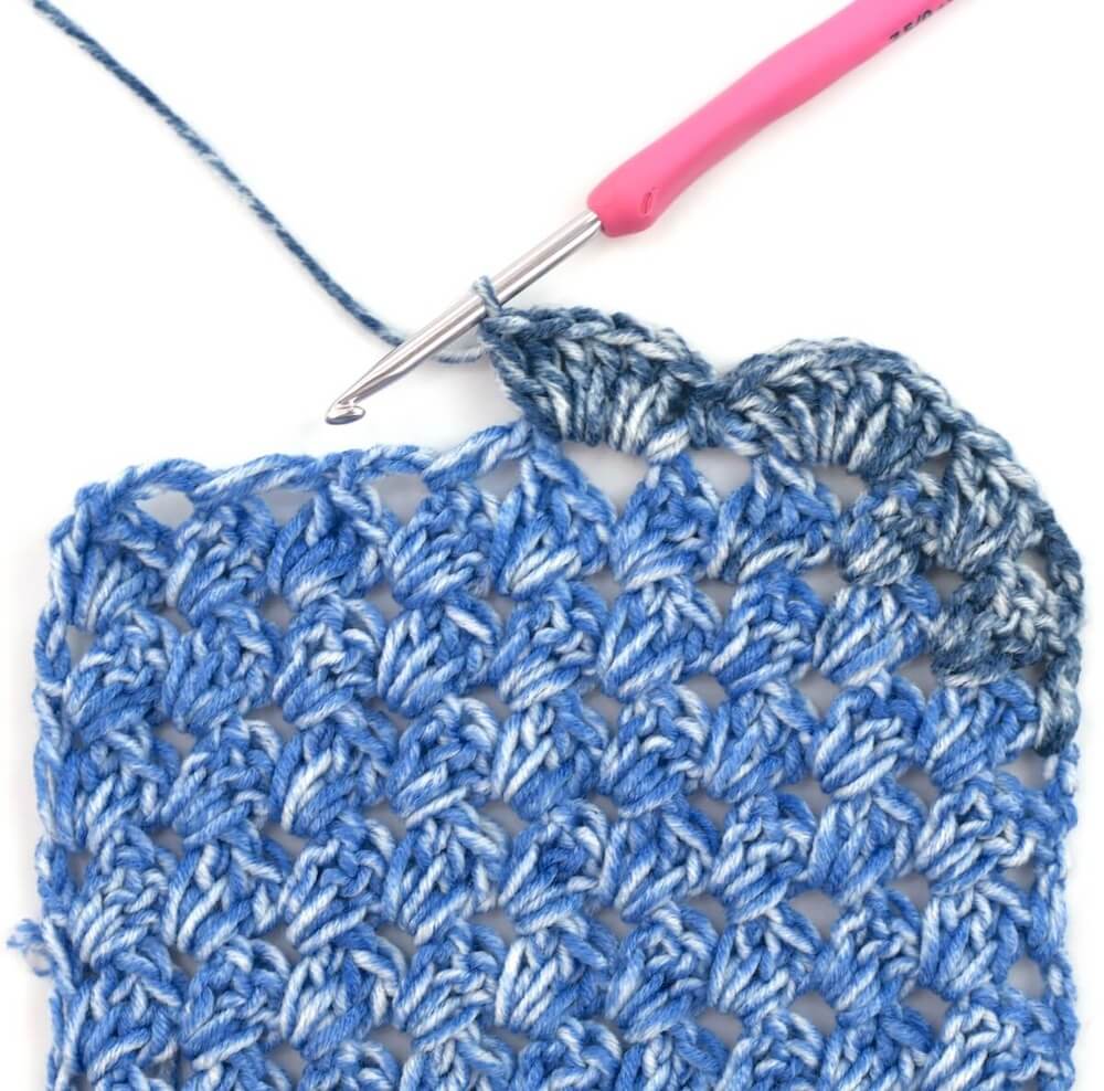 blue yarn and crochet hook
