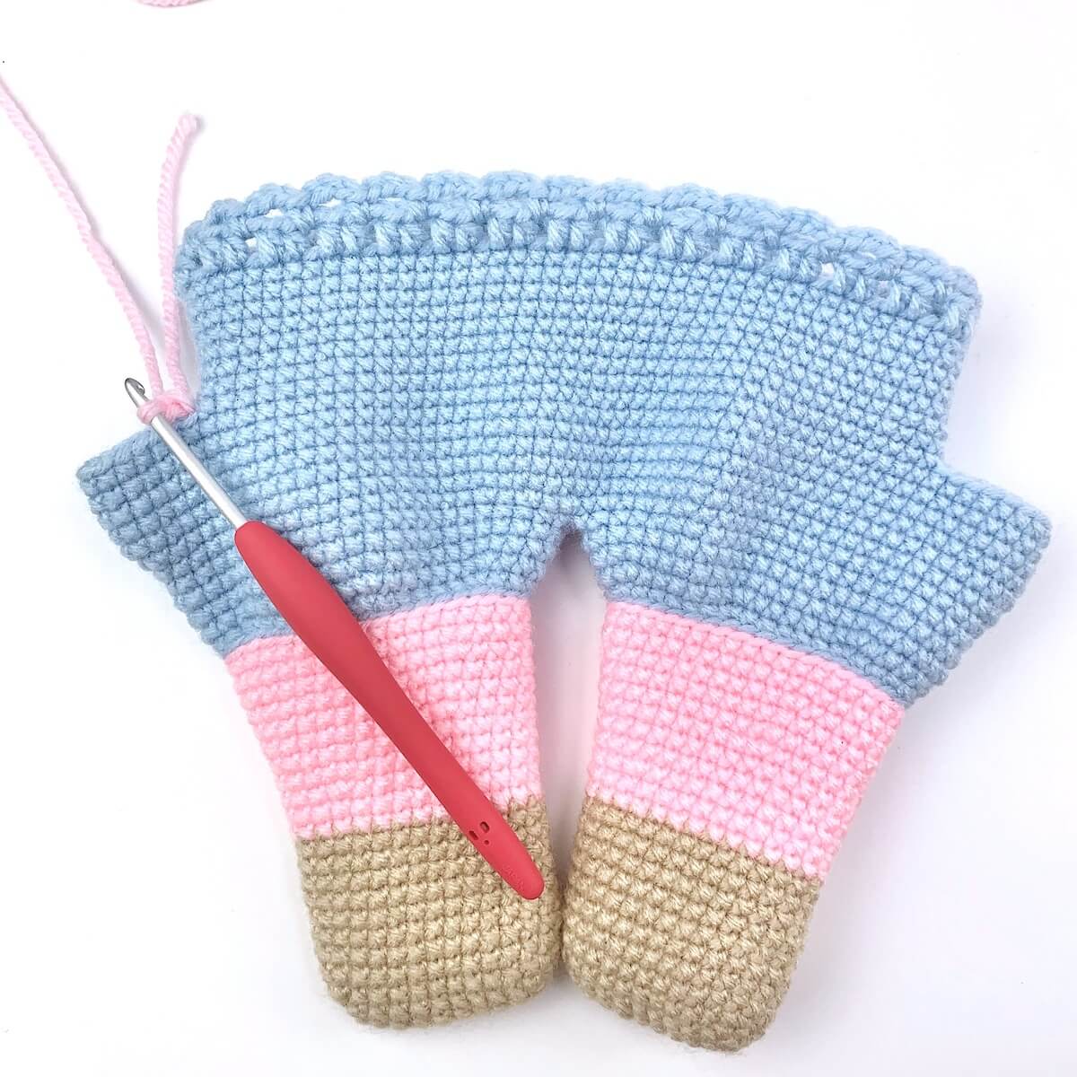 Creating the right arm of the crochet pig using continuous rounds