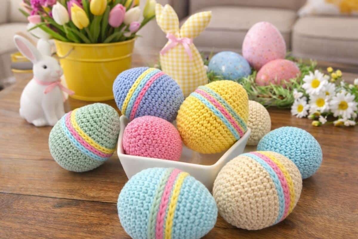 A close up of crochet Easter eggs with surface slip stitch stripes