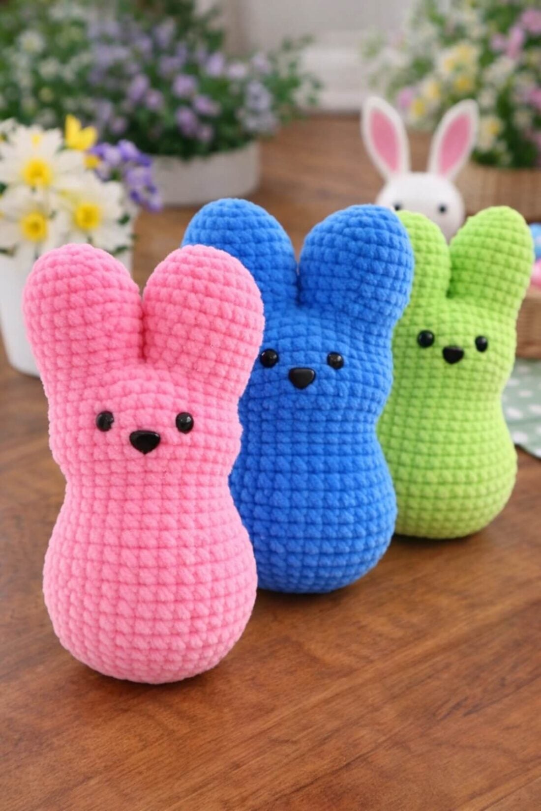 Soft plush Amigurumi marshmallow peep bunny crochet pattern made with chenille yarn in bright spring colors, displayed as Easter décor.