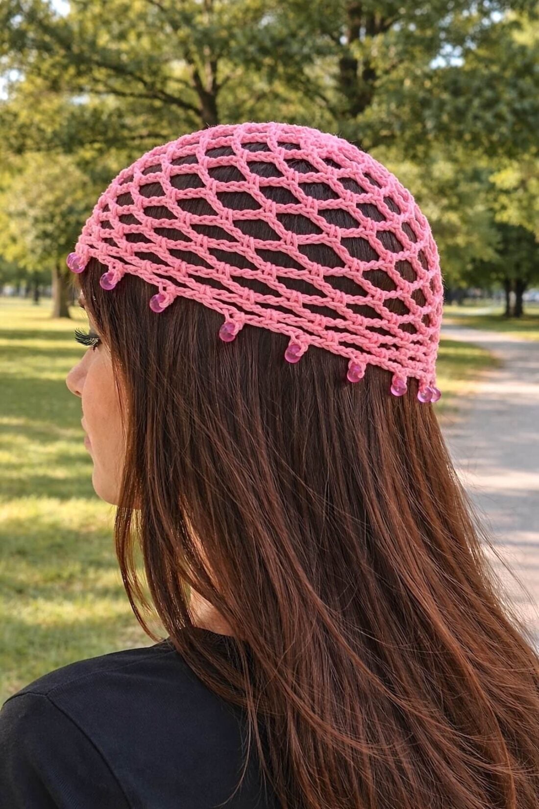Pink crochet mesh skull cap with bead edging on female model