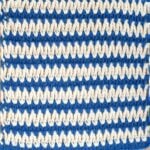 Two-color crochet V stitch swatch for stitch tutorial.